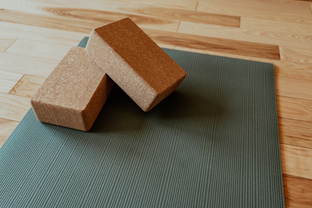 yoga a-yoga-mat-with-two-blocks-on-top-of-it-b8q5fhbsyik